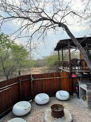 a group of white bowls sitting on a patio at Sonbesie in Marloth Park