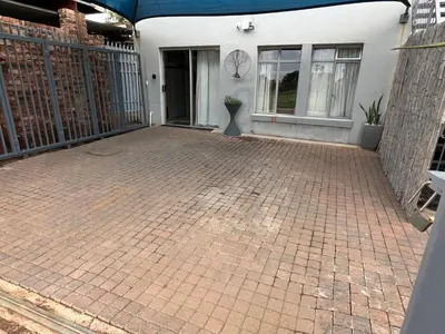 a brick driveway in front of a house at Kiewiets Creek Guesthouse in Pretoria