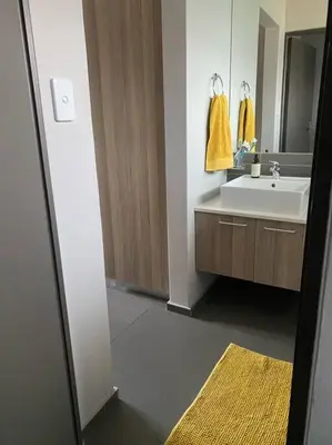 a bathroom with a sink and a mirror at The Blues in Pretoria