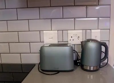 a toaster and toaster sitting on a kitchen counter at Secure 1 Bedroom Apartment in Midrand, Waterfall City - Lock Up and Go - Free WIFI and Parking - 7 Elizabeth Place in Midrand
