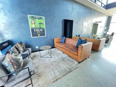 a living room with a couch and couches at Spacious 2 Bedroom Apartment in Midrand, Waterfall City - Business and Family friendly - 12 Elizabeth Place in Midrand