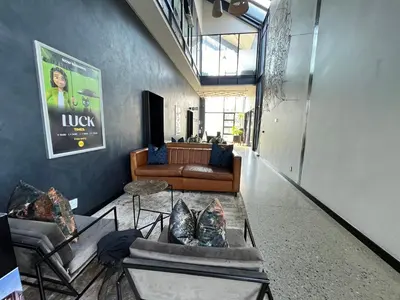 a living room with couches and a couch at Spacious 2 Bedroom Apartment in Midrand, Waterfall City - Business and Family friendly - 10 Elizabeth Place in Midrand