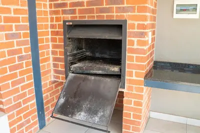 a brick oven with its door open in a building at Large 3 Bedroom Apartment in Midrand, Waterfall City - More space than a hotel room - Ideal for families, groups and work trips - 16 Elizabeth Place in Midrand