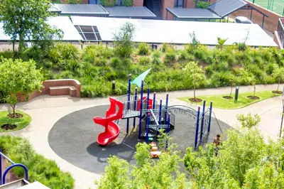 a playground with a slide in a park at Large 3 Bedroom Apartment in Midrand, Waterfall City - More space than a hotel room - Ideal for families, groups and work trips - 16 Elizabeth Place in Midrand
