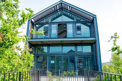 a glass house with a balcony on top of it at Large 3 Bedroom Apartment in Midrand, Waterfall City - More space than a hotel room - Ideal for families, groups and work trips - 16 Elizabeth Place in Midrand