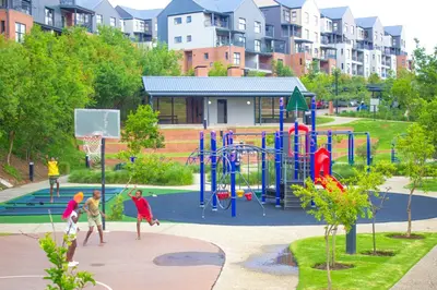 a group of children playing in a playground at Large 3 Bedroom Apartment in Midrand, Waterfall City - More space than a hotel room - Ideal for families, groups and work trips - 16 Elizabeth Place in Midrand