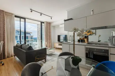 a kitchen and living room with a view of a city at Elipse Waterfall-2803 in Midrand