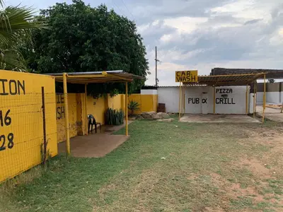 a building with signs on the side of it at Bobirwa Resort & Accomodation in Polokwane