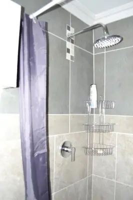 a shower with a glass door in a bathroom at Soldout Camp 2 in Pretoria