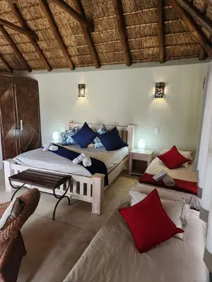 a bedroom with two beds with blue and red pillows at Heartland Self-catering Accommodation in Kampersrus AH