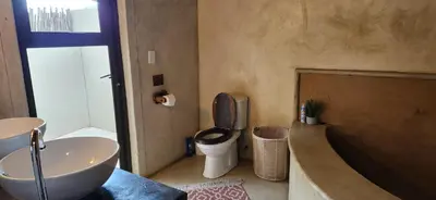 a bathroom with a sink and a toilet and a tub at Heartland Self-catering Accommodation in Kampersrus AH