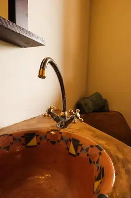 a sink with a faucet in a bathroom at Bushvilla's Silonque in Phalaborwa