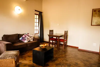 a living room with a couch and a table at Bushvilla's Silonque in Phalaborwa