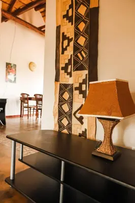 a table with a lamp on top of it at Bushvilla's Silonque in Phalaborwa