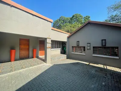 a house with a brick driveway in front of it at Betel in White River