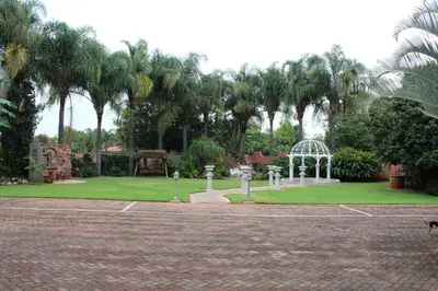a park with a playground and a gazebo at El Gran Chaparral Guest House in Pretoria