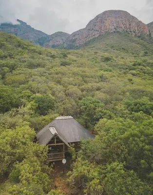 an old cabin in the middle of a mountain at Amafu Forest Lodge in Hoedspruit