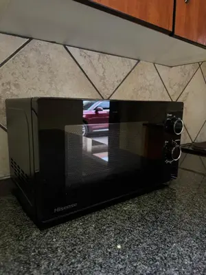 a microwave oven sitting on top of a counter at Thorntree Self Catering Apartment, Witbank in Witbank
