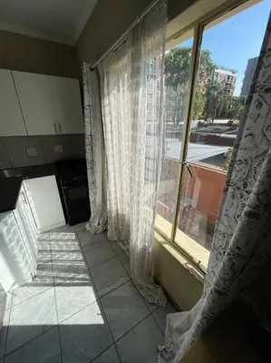 a room with a window and a tiled floor at 4-Bedroom Apartment in Pretoria