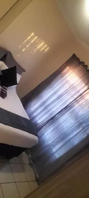 a bed in a room with a window at Marelden security estate in Witbank