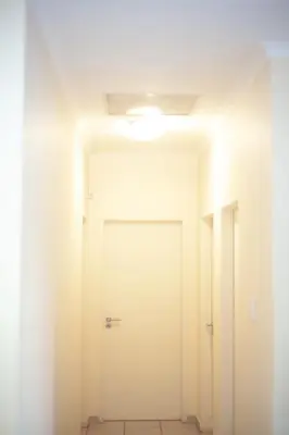 a hallway with a white door and a ceiling at Marelden security estate in Witbank