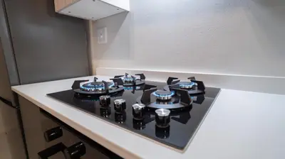 a stove top in a kitchen with a white counter top at Modern Midrand Gem in Midrand