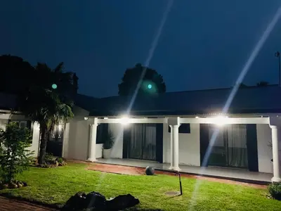 a house at night with a green light at TnB Guesthouse in Middelburg