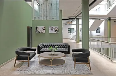 a living room with couches and a table and chairs at Circa unit 91 in Pretoria
