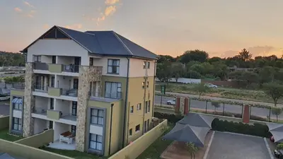 an overhead view of a yellow apartment building at URlyfstyle Apex Executive 8min to Mall of Africa in Midrand