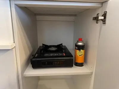 a stove sitting on a shelf in a closet at De Vlei - Private Accommodation in Garsfontein in Pretoria