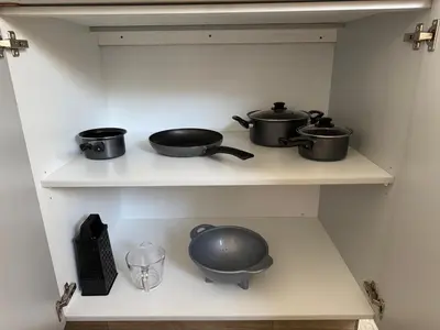 two pots and pans on a shelf in a kitchen at De Vlei - Private Accommodation in Garsfontein in Pretoria
