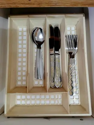 a wooden box with utensils in it at GLESTER GUEST HOUSE in Pretoria