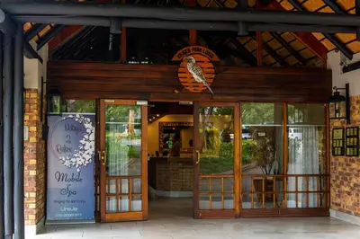 a building with a bird on the front of it at Kruger Park Lodge Unit No. 253 in Hazyview
