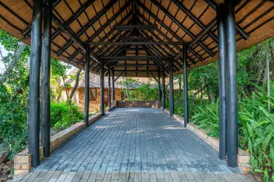 a covered walkway in a building with a roof at Kruger Park Lodge Unit No. 516 in Hazyview