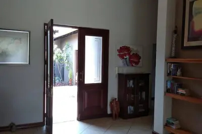 a room with an open door with a window at Pecanwood Estate Cosy home 3 bedrooms with pool in Hartbeespoort