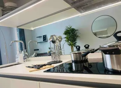 a kitchen counter with a sink with a pot on it at Views on the six in Midrand