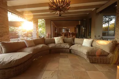 a large brown couch sitting in a living room at Shiandi Villa in Hoedspruit
