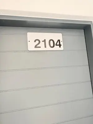 a white garage door with a sign on it at Monochrome View in Nelspruit