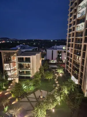 an overhead view of a park in a city at night at Menlyn Maine Residences 721 in Pretoria