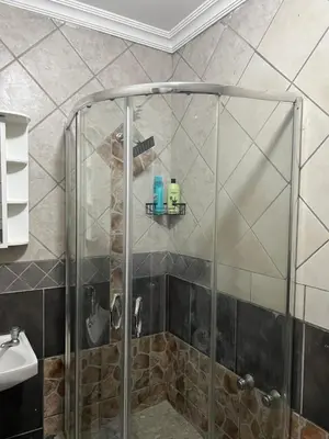 a shower with a glass door in a bathroom at MorningMist Boutique Sun in Centurion