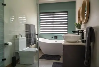 a bathroom with a toilet and a sink and a mirror at Highland gate Golf estate Mountain view 780 in Dullstroom