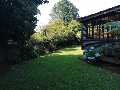 a yard with a small house with a yard at Traveller's dream in Graskop