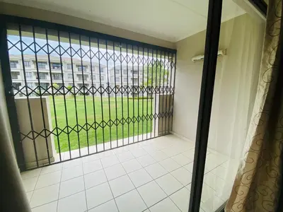 a room with a window with a view of a building at Siena Sun Apartment 10 in Midrand