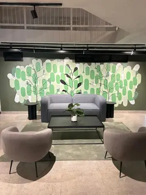a living room with a couch and two chairs at Circa Apartment 86 in Pretoria