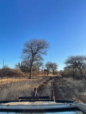 a view of a dirt road with trees in the distance at Winterfell Lephalale Lodge in Lephalale