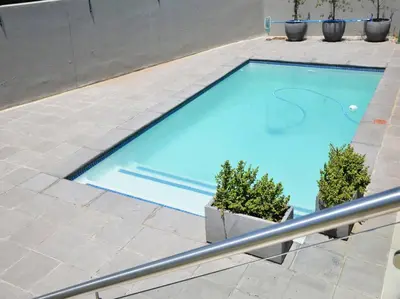 a large blue swimming pool on a patio at Elcaro Luxury Villas - The View in Midrand
