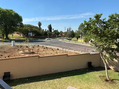a retaining wall with a garden in a street at ATHA AirBnB in Midrand