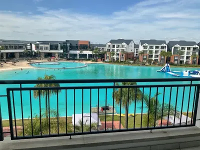 a view of a swimming pool in a resort at The Blyde Stylish Homes in Pretoria