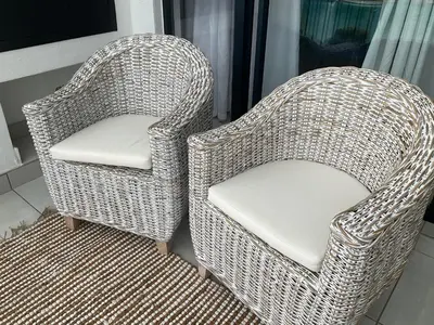 two wicker chairs sitting next to each other at The Blyde Stylish Homes in Pretoria
