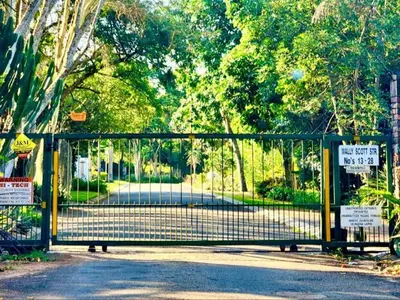 a gate in a park with signs on it at Ambience Inn in White River